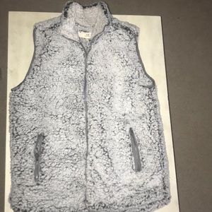 Super nice fuzzy vest. NEVER WORN